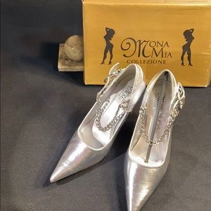 Glistening silver, chain strapped, high heel shoe